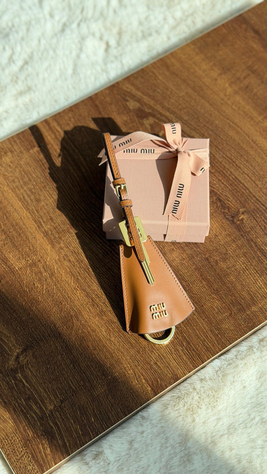 Miu Miu logo-lettering leather trick